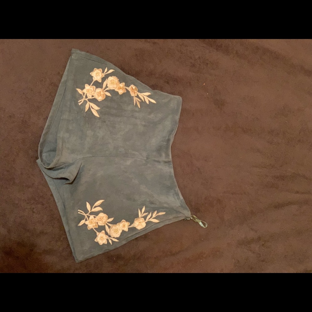 Light blue suede shorts with flower design